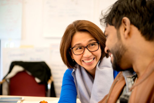 Two persons talking and laughing
