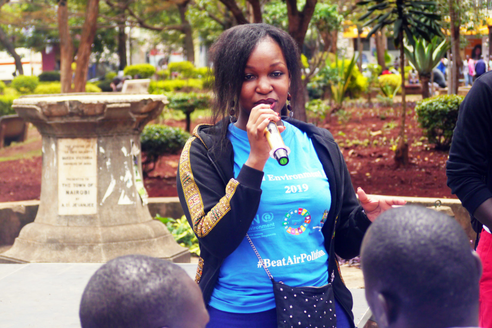 SI scholarship holder, Judith Achieng’ Oginga, is talking in front of some persons.