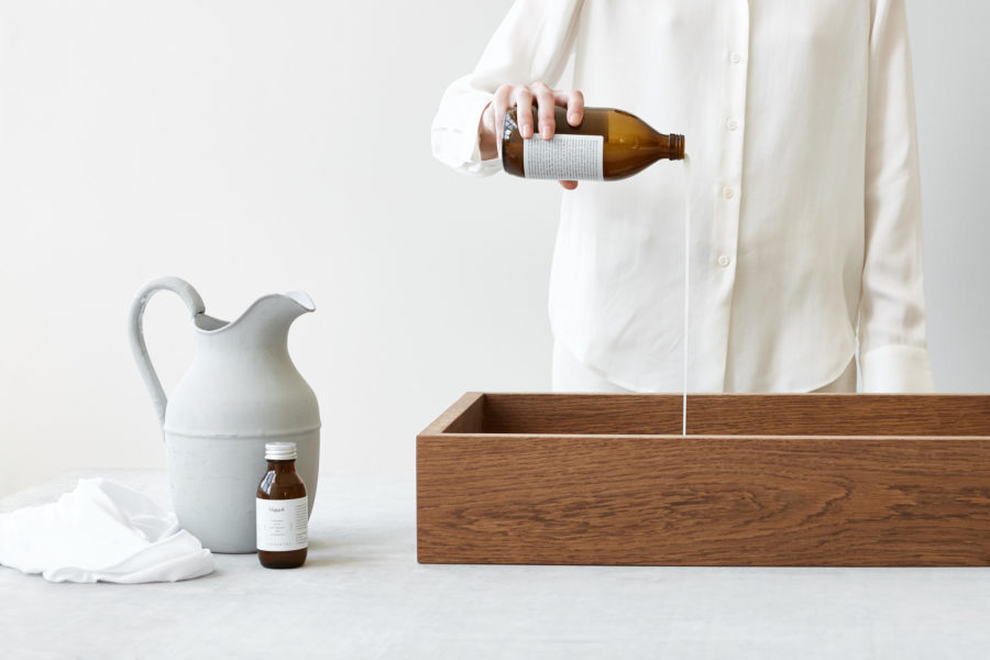 Using simple methods and materials the lifetime of your garments can effectively be prolongued. Like for for example the photo shows someone pouring some liquid. The photo is used to illustrate a person doing a hack at home. Photo by:Chris Tonnesen/ Filippa K