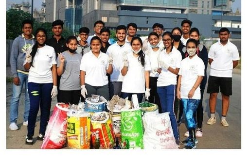 Sweden India Alumni network group picture with plastic bags