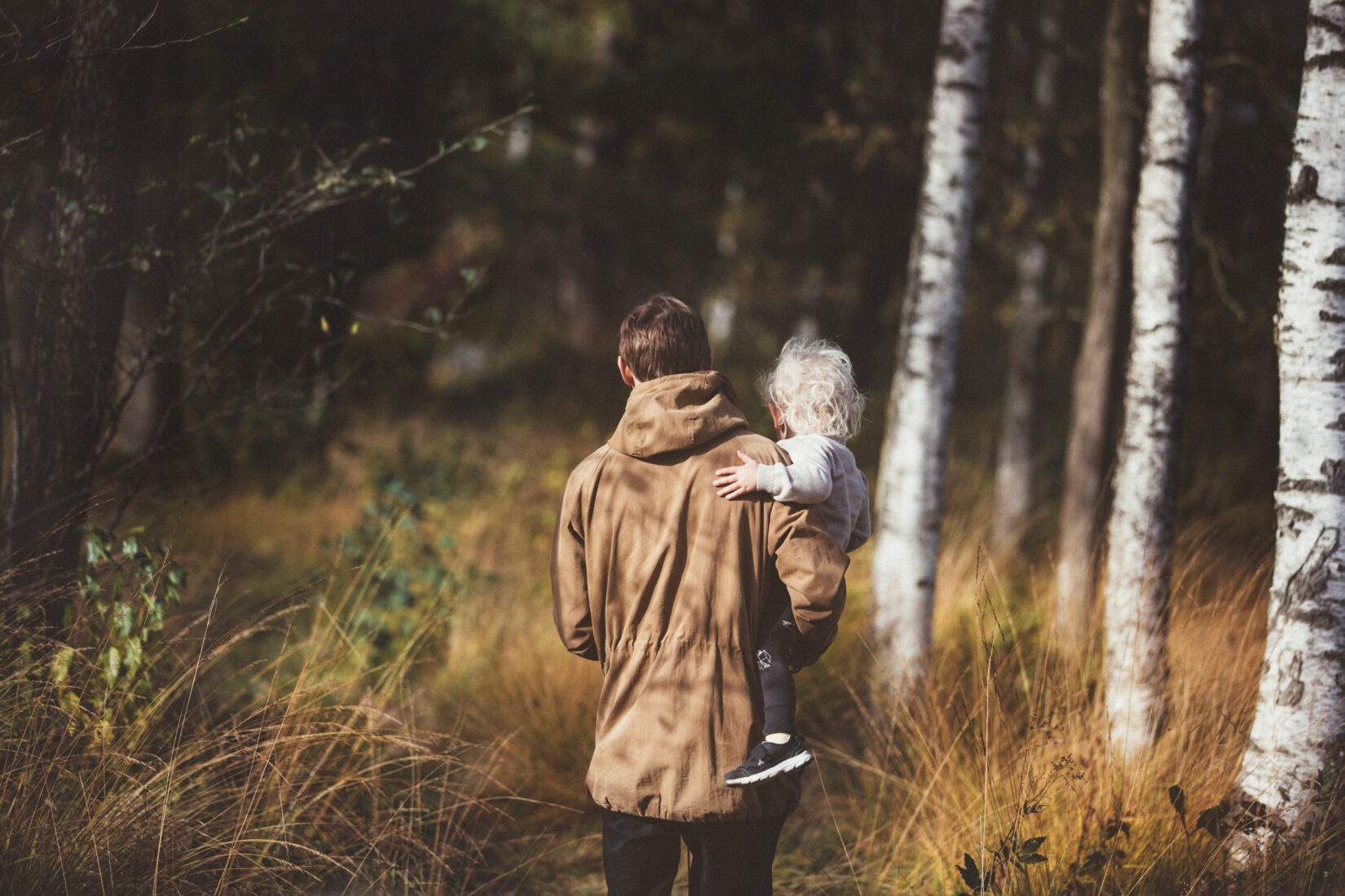 Father and child in forest