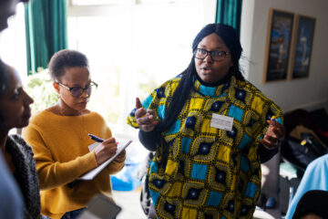 Two women in a workshop having a discussion during SIMP Africa.