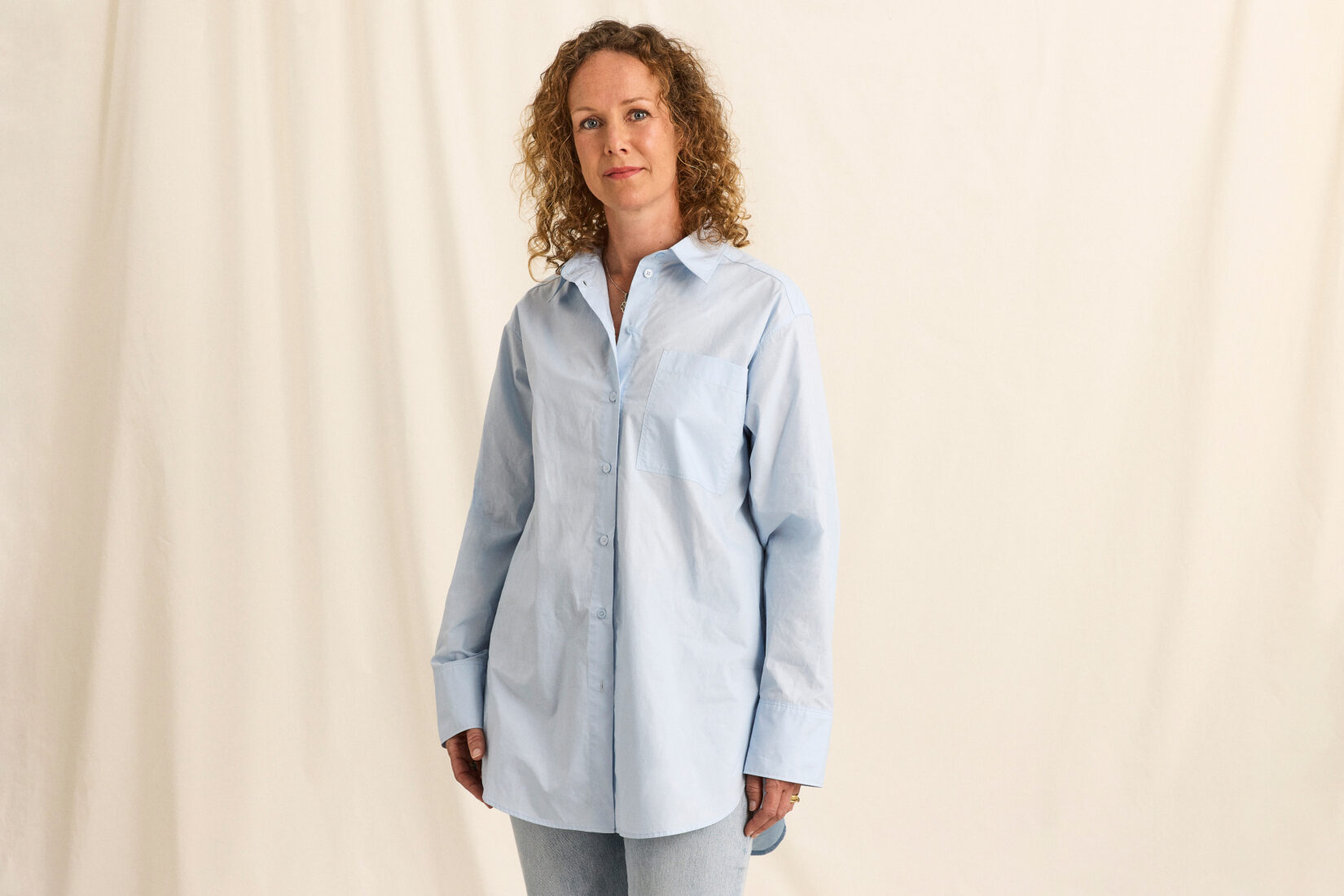 Anna-Karin_Dahlberg Woman in curly hair and blue shirt