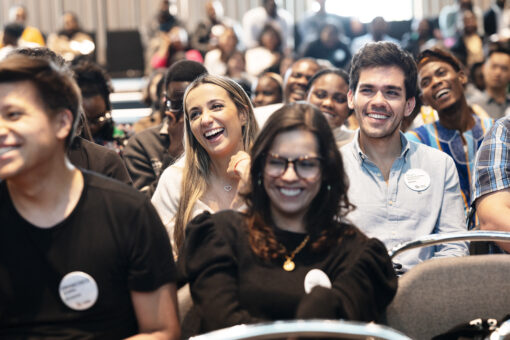 People smiling in an audience
