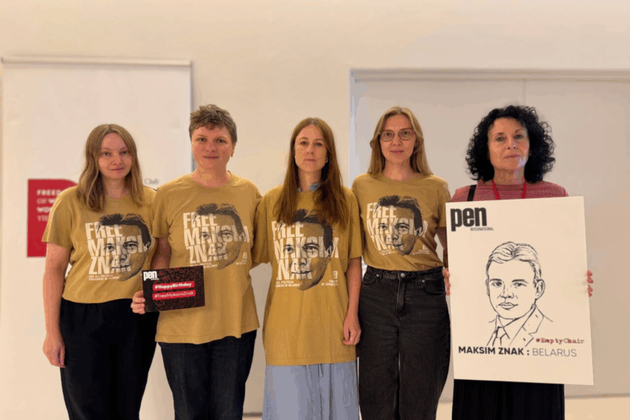 Five women with matching t-shirts. 